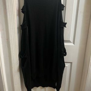 long,black,ripped long sleeve, knitted material, sweater.